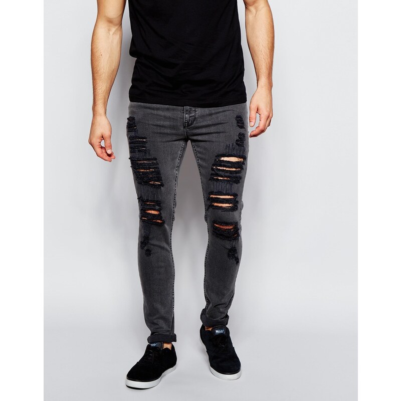 ASOS - Super Skinny Jeans mit starken Rissen in verwaschenem Schwarz - Schwarz