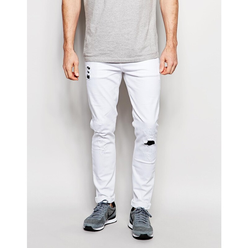 ASOS - Weiße Skinny-Jeans mit Abnutzungen und Indigo-Aufnähern - Weiß