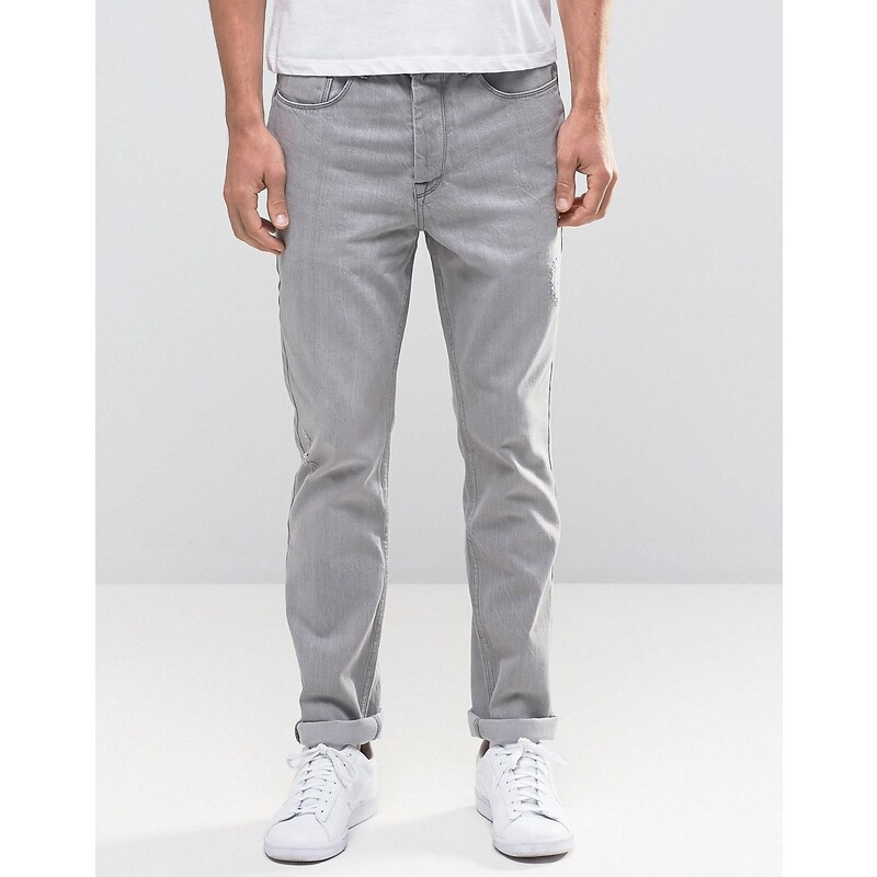 Kubban - Schmal zulaufende Denim-Jeans in grauer Waschung mit Fransensaum - Grau