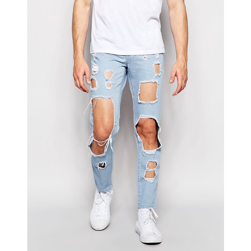 Brooklyn Supply Co - Enge Jeans mit Cutouts in heller Waschung - Blau