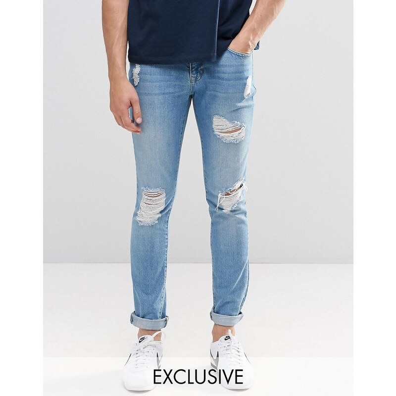 Brooklyn Supply Co - Superenge Skinny-Jeans in heller Stone-Waschung mit Zierrissen - Blau