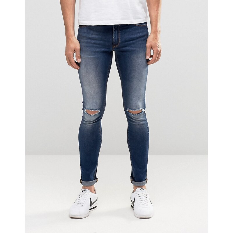 ASOS - Extrem enge Jeans in verwaschenem Mittelblau mit Rissen an den Knien - Blau