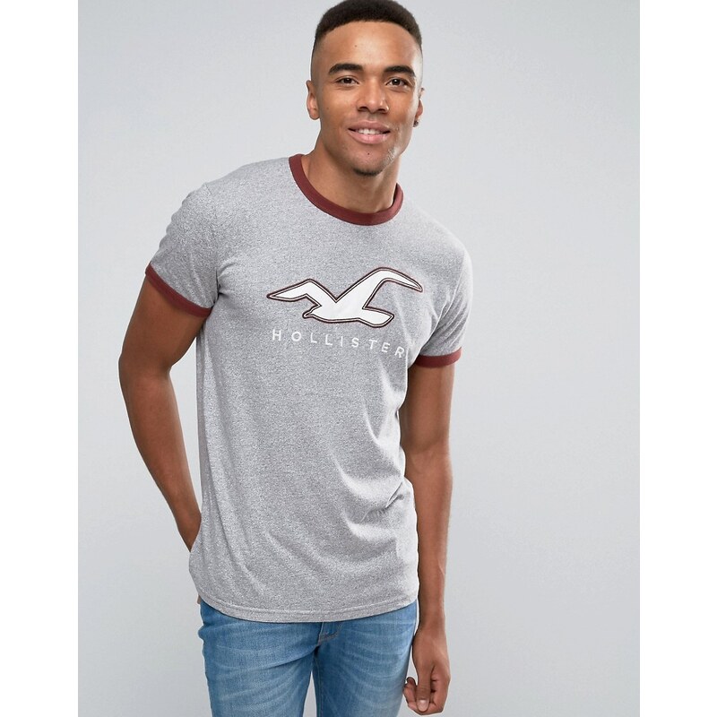 Hollister - Schmales, graues Ringer-T-Shirt mit rundem Logo - Grau