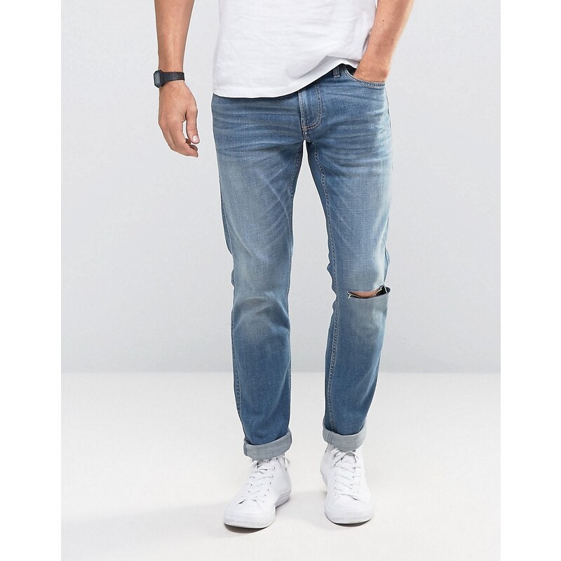 Hollister - Skinny-Jeans mit Stretch und Flicken, mittelblaue Waschung - Blau